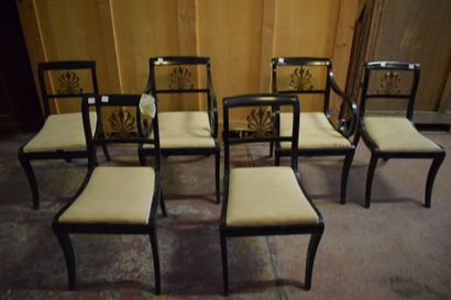 null Deux fauteuils et quatre chaises de style klismos en bois noirci, motif en métal...