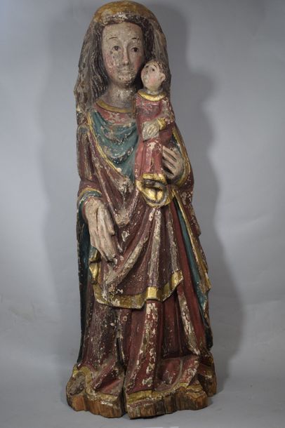 null Vierge à l'Enfant en bois de résineux sculpté polychromé et doré, dos creusé.

Espagne,...