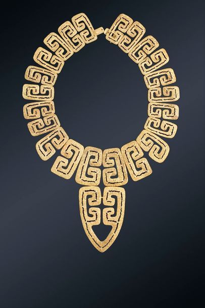 null Zolotas

Important collier en or jaune 18K (750) granité, articulé de grecques...