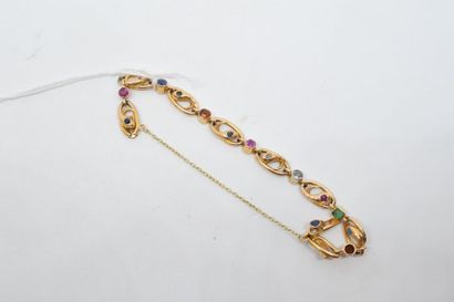 null Bracelet en or jaune 18k (750) stylisant des serpents ornés de diamants et pierres...