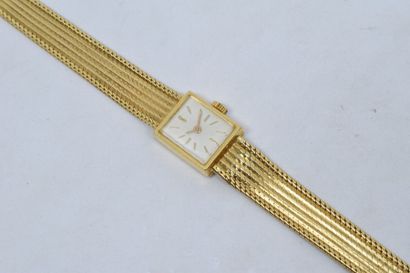 null Montre bracelet de dame en or jaune 18k (750), cadran carré à fond crème et...