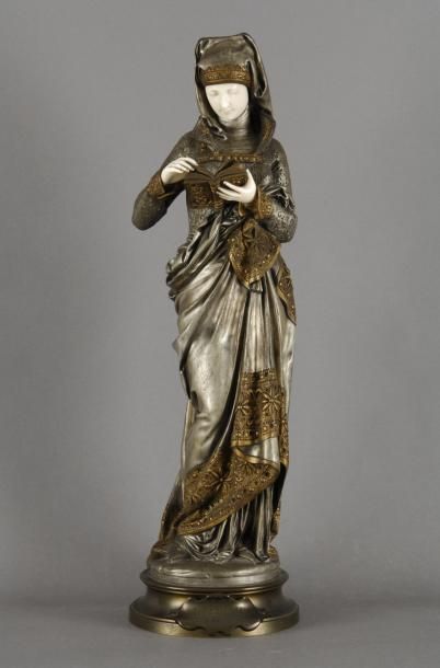 CARRIER-BELLEUSE Albert-Ernest, 1824-1887 La liseuse Bronze à patine dorée et argentée...