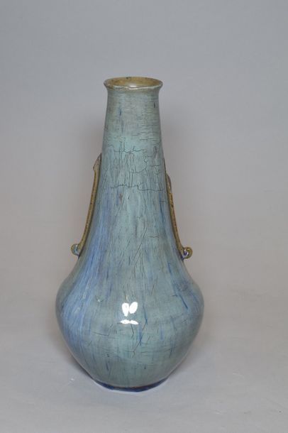 null Auguste DELAHERCHE (1857-1940)	

Vase en céramique à col conique sur base renflée...
