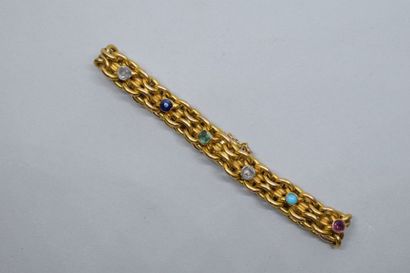 null Bracelet en or jaune 18k (750) orné de deux diamants taillés en rose, d'un saphir,...