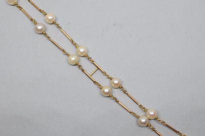 null Bracelet deux rangs en or jaune 18k (750) maillons séparés par des perles de...