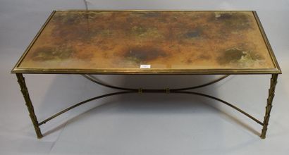 null BAGUÈS

Table basse à structure en bronze doré à corps de palmiers et

plateau...