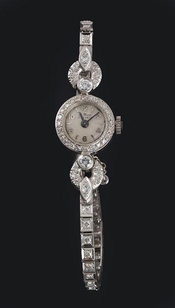 null MONDIA - OR BLANC 14K 
14k white gold Mondia lady's watch, the case and bracelet...