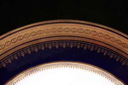 null L. BERNARDEAU CIE - LIMOGES
Set of Limoges porcelain with blue and gold border...