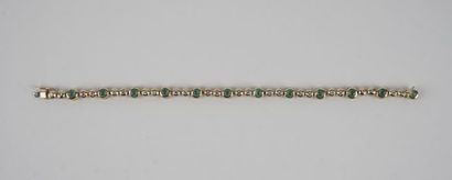 null 18K GOLD BRACELET WITH EMERALDS DIAMONDS
Bracelet in 18K yellow gold, set with...