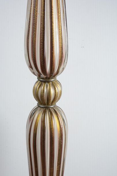 null Mid-century modern style Murano floor lamp. Lamp is white and gilded stripes...