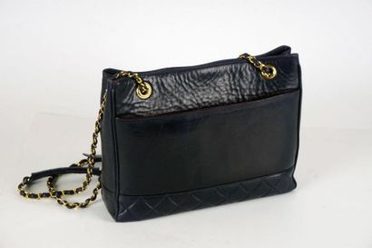 null CHANEL BAG
Circa 1990 - 32cm Cabas bag in partially quilted black lambskin,...