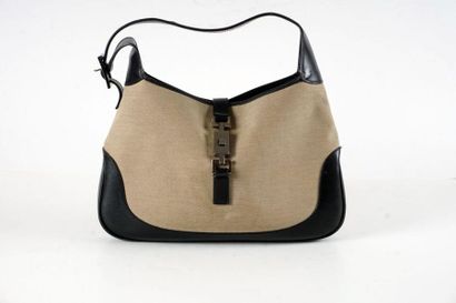 null GUCCI BAG
"Jackie" bag 32cm in beige fabric and black calfskin, lobster clasp...