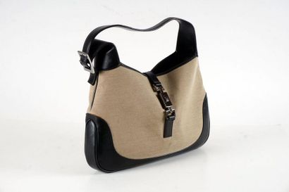 null GUCCI BAG
"Jackie" bag 32cm in beige fabric and black calfskin, lobster clasp...