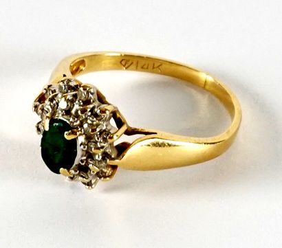 null 14K GOLD, EMERALD DIAMONDS RING
14K yellow gold ring, set with an emerald and...