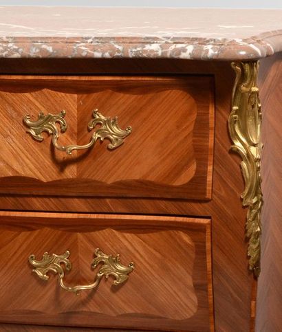 null Louis XV style chest of drawers in rosewood veneer and marquetry, curved front...