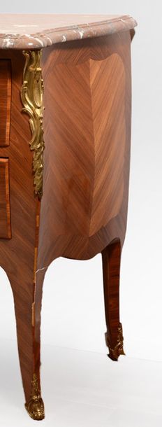 null Louis XV style chest of drawers in rosewood veneer and marquetry, curved front...
