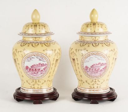null PORCELAIN AND ENAMEL
Pair of porcelain and yellow enamel lidded vases in the...