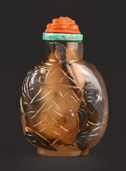 null CHINA, AGATE
Carved agate snuff bottle of a character in a mountain landscape....