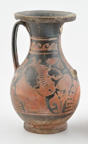 null ANTIQUE POTTERY
A Greek red pottery decorated with the head of woman in profile...