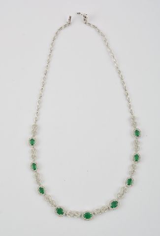 null 18K GOLD, DIAMONDS AND EMERALDS
18K white gold articulated necklace with a plastron...