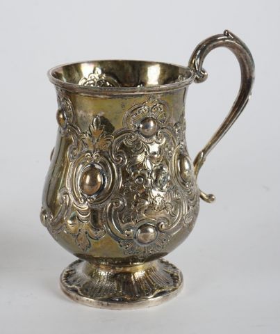 null STERLING SILVER, ENGLAND
Set of English punched pieces including:
- A mug, sterling...