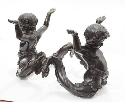 null Bronze and glass Putti di Mare coffee table, with a decor of two bronze cherubs...