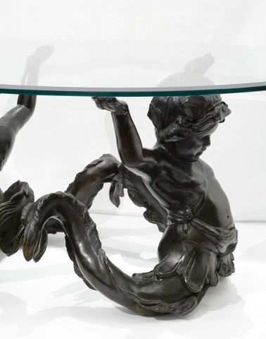 null Bronze and glass Putti di Mare coffee table, with a decor of two bronze cherubs...