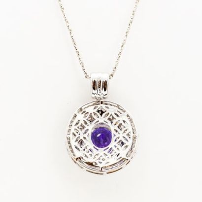 null 14K white gold pendant and chain, set with an oval tanzanite in a triple border...