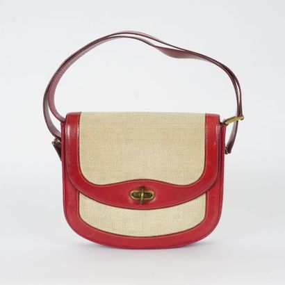 null HERMÈS

Red leather and beige fabric handbag with double straps, purse and mirror...