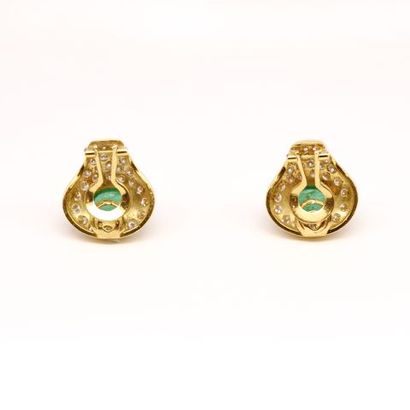 null A pair of 18K yellow gold earrings set with emerald cabochons on a pavé of brilliant...