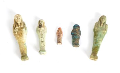  Five Egyptian funerary statuettes (Shabtis), Late Period (600 BC). Four faience...