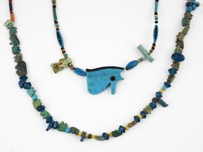 null Two Egyptian faience necklaces, one of which contains a glazed faience Wedjat...