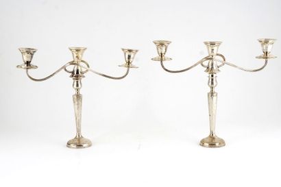  Pair of candlesticks with lively arms, octogonal bole, in sterling silver, hallmarked...