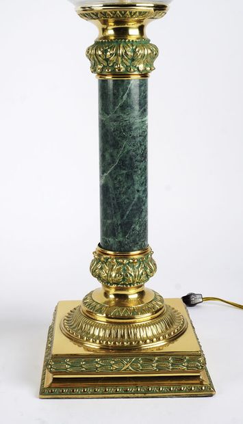 Pair of lamps, large cut glass globes on sage-colored marble shaft mounted on a...