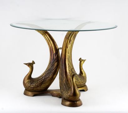  Attributed to Alain CHERVET 
Low table, with a gilt metal base with 3 birds, glass...
