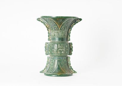 null GU VASE

Gu vase in hard green stone, with archaic decoration of a kui dragon,...