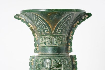 null GU VASE

Gu vase in hard green stone, with archaic decoration of a kui dragon,...