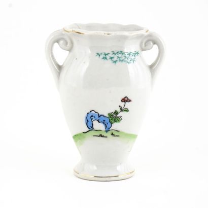 null Small Japanese white vase on each side of which are attached two handles. On...