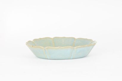 null PLATE 

Lotiform cup in porcelain and enameled crackled celadon blue, in which...