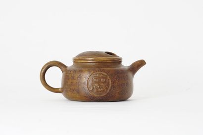  TEAPOT 
Yixing teapot, decorated with the character Zhong (Loyalty) in a medallion...