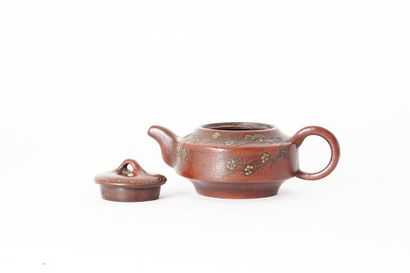 null TEAPOT

Yixing teapot, decorated with flowering prunus branches and bearing...