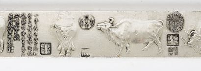 null PAPER WEIGHTS 

A pair of silver weights, decorated with buffaloes from the...