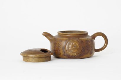 null TEAPOT 

Yixing teapot, decorated with the character Zhong (Loyalty) in a medallion...