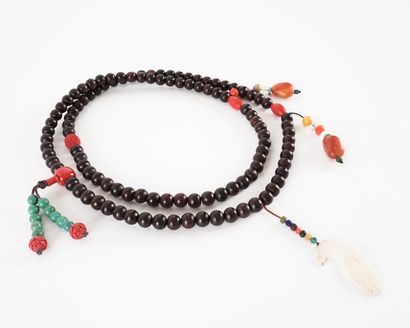null Sino-Tibetan horn and beeswax ceremonial necklace.

China, early 20th Century

Length:...