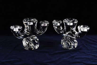 null Pair of solid DAUM crystal candlesticks, with three sconces and twirled base....