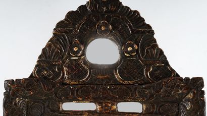 null Dark wood glazing mirror, the pediment decorated with three flowers and palm...