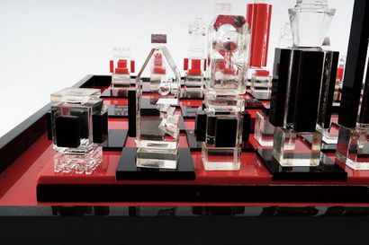 null Red, black and translucent Lucite chess game. The chessboard has two levels.

Dalot...