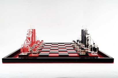 null Red, black and translucent Lucite chess game. The chessboard has two levels.

Dalot...