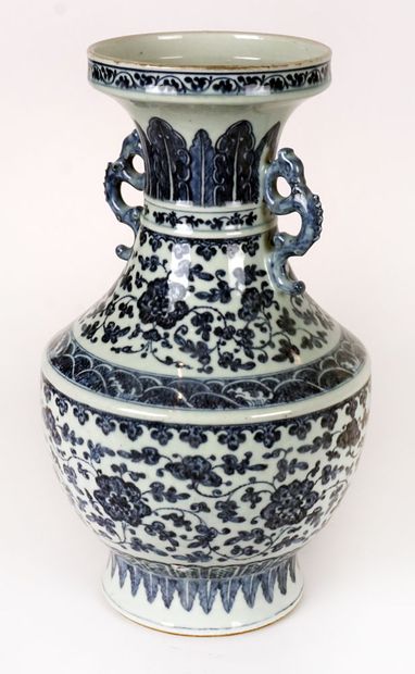 null Baluster vase in blue-white porcelain, decorated with peony flowers, foliage...