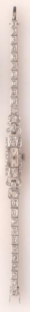 null Bracelet-montre de dame en platine (poinçonné), serti de diamants. Poids: 24.2gr....